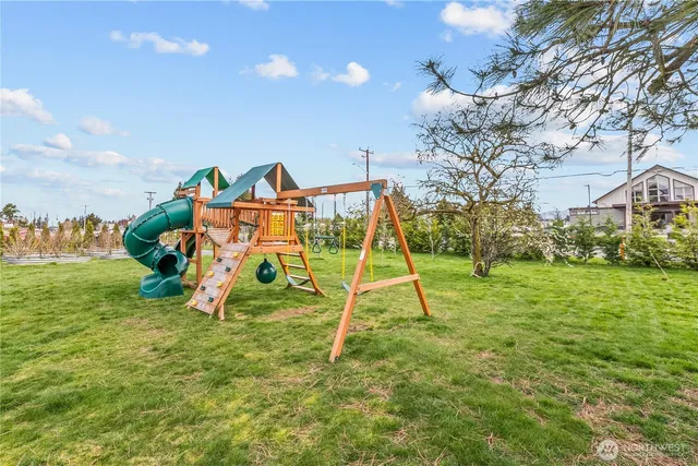 a view of a house with backyard porch and sitting area
