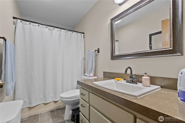 a bedroom with furniture and a bed