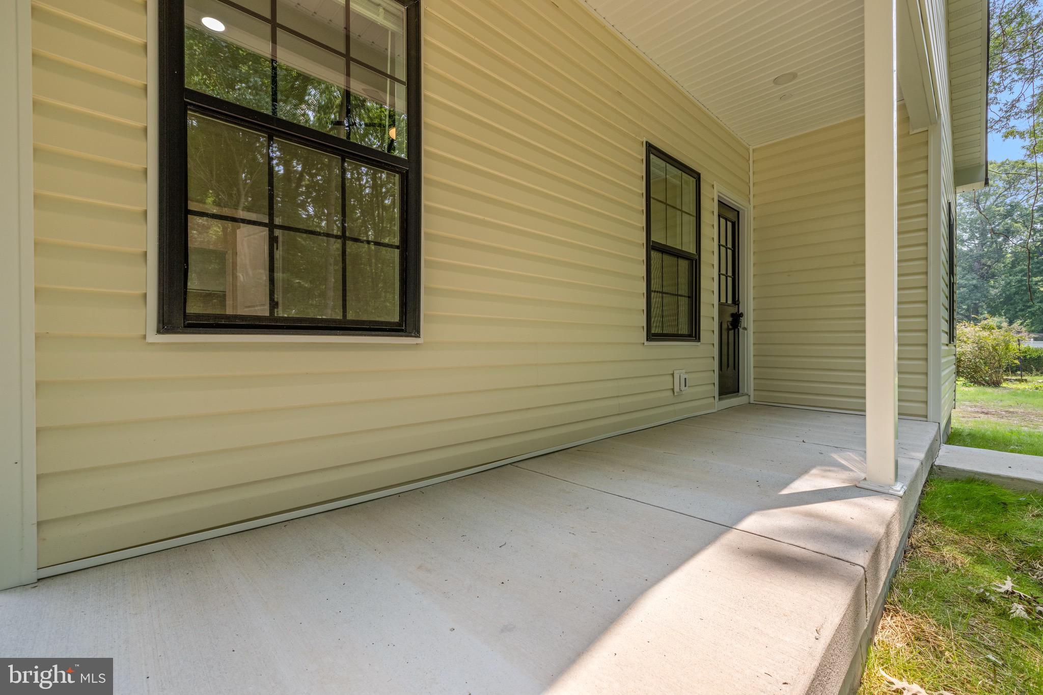 1617 Stone Boundary Road Cambridge, MD 21613 - Photo 37 of 41 Rear porch perfect for rocking chairs