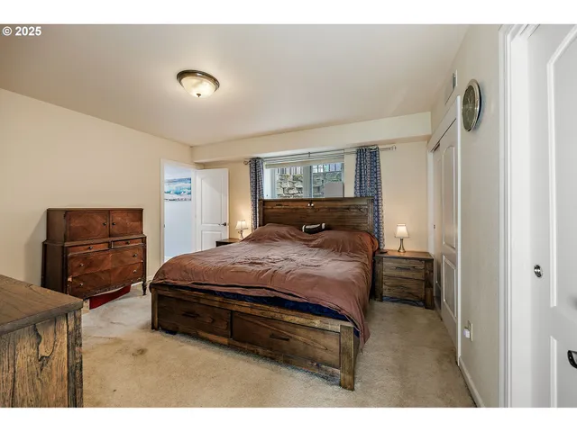a bedroom with a bed and dresser
