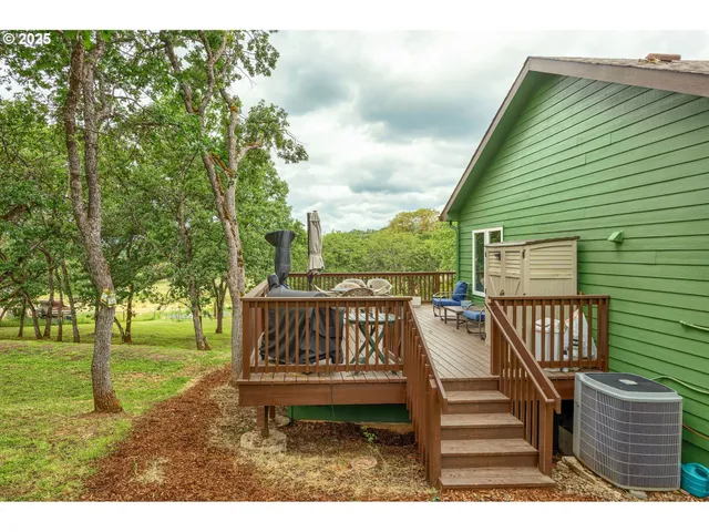 a view of a bench in the backyard