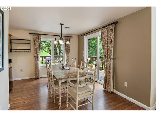 a dining room with furniture window and outside view