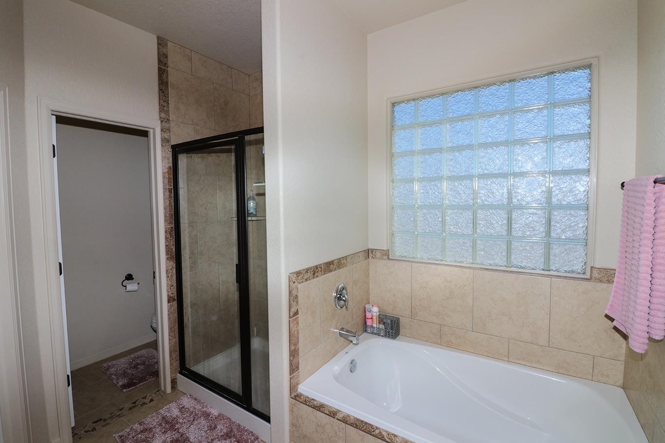 2011 Roma Avenue Fruita, CO 81521 - Photo 16 of 31 a bathroom with a tub and shower