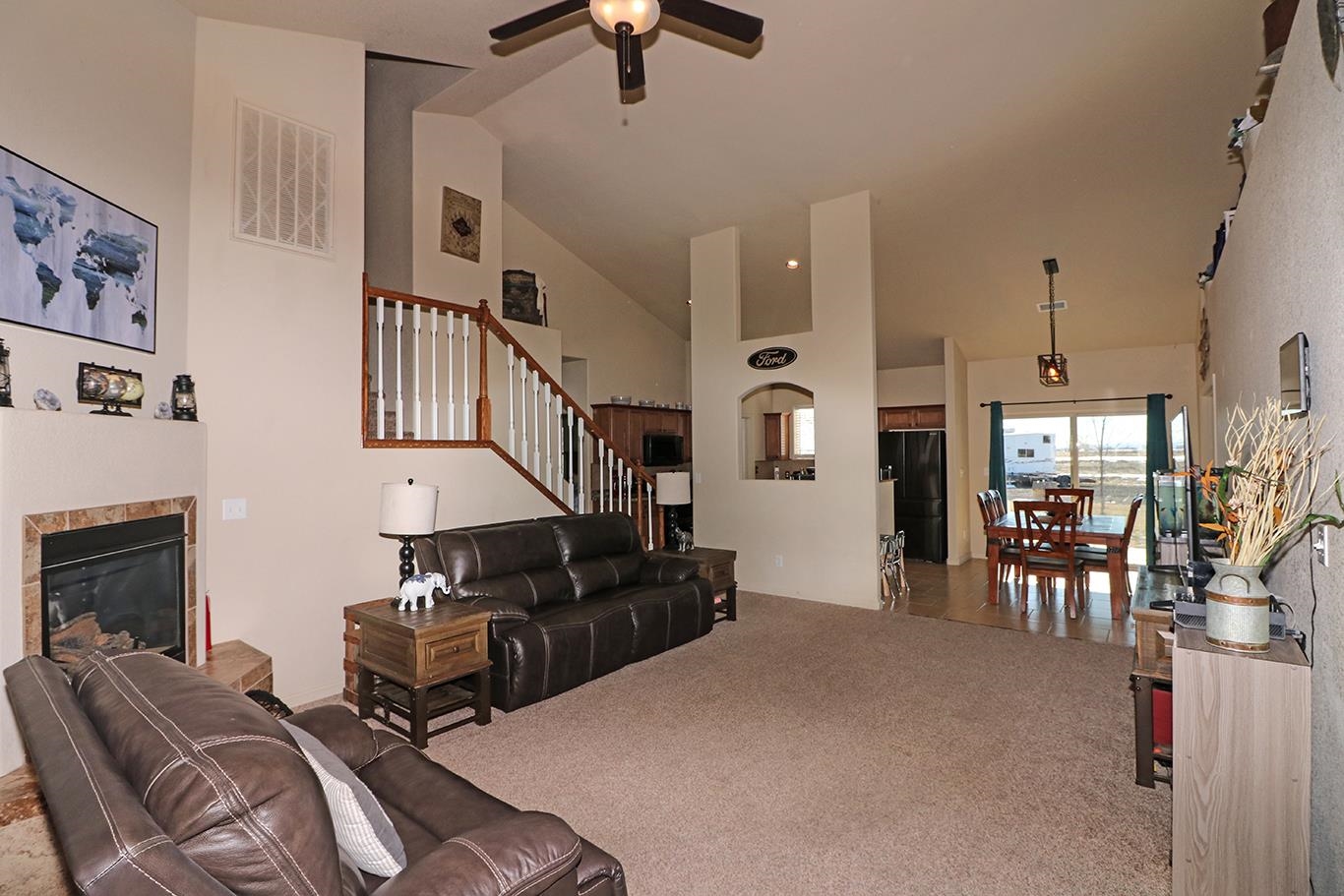 2011 Roma Avenue Fruita, CO 81521 - Photo 2 of 31 a living room with furniture ceiling fan and a fireplace