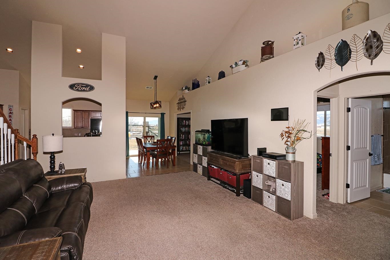 2011 Roma Avenue Fruita, CO 81521 - Photo 3 of 31 a living room with furniture and a flat screen tv