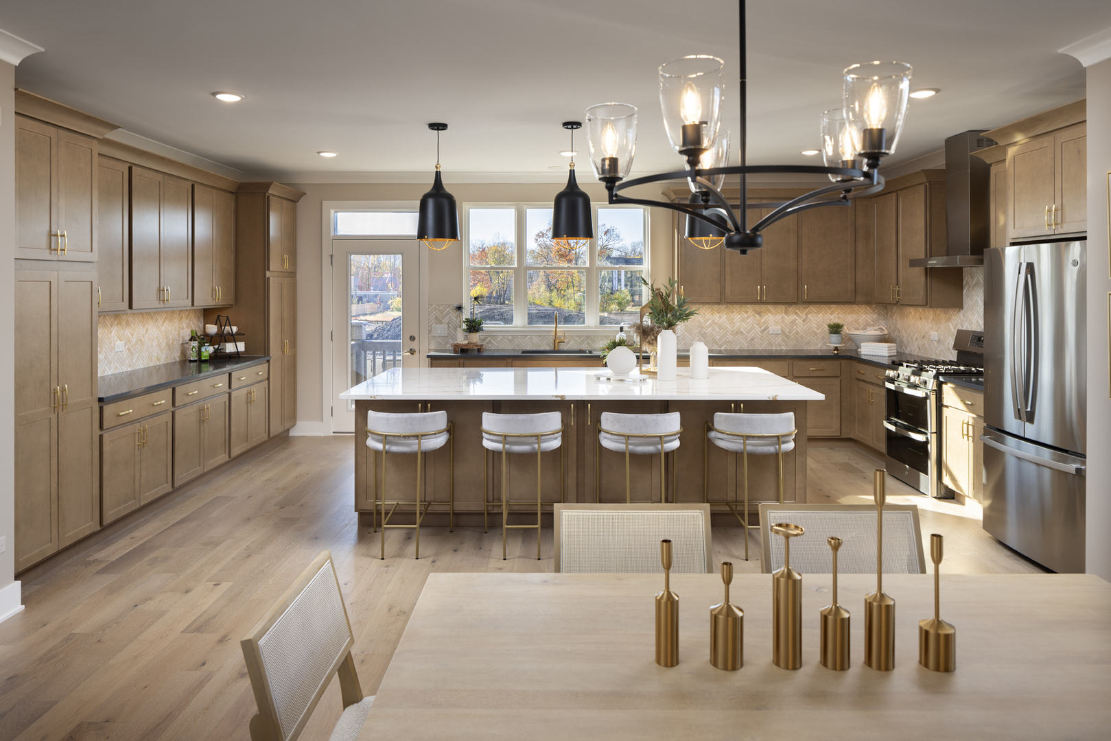 2767 Stone Circle Geneva, IL 60134 - Photo 2 of 12 a large kitchen with a table and chairs