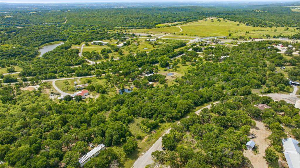 151 High Point Road Weatherford, TX 76088 - Photo 38 of 40 an aerial view of residential houses with outdoor space and trees