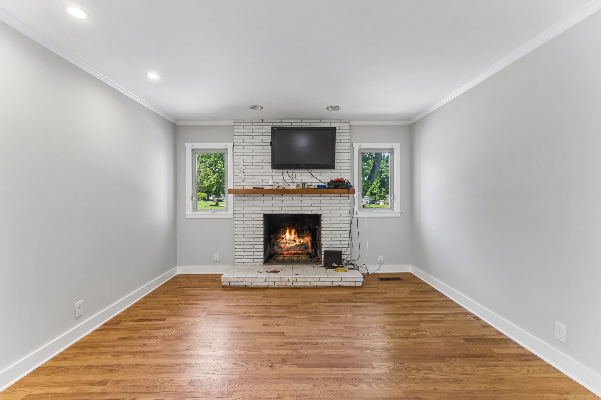 4425 Prescott Road Nashville, TN 37204 - Photo 21 of 36 a view of a livingroom with a fireplace a fireplace and wooden floor