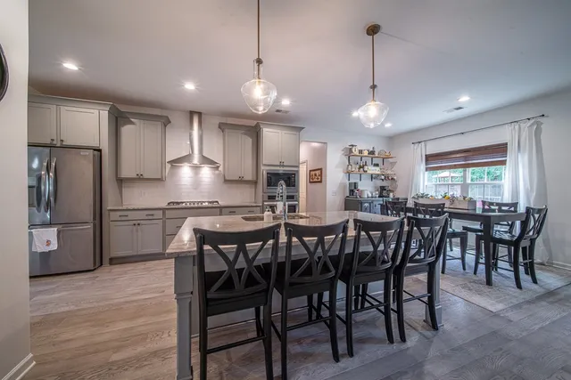 a view of a dining area with furniture window and wooden floor