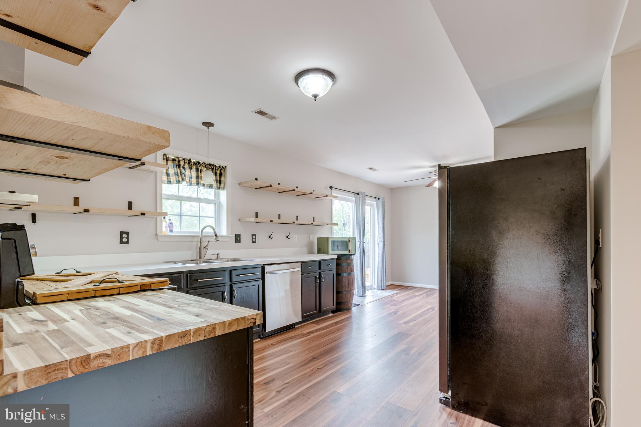 25308 Military Road Cascade, MD 21719 - Photo 4 of 43 a kitchen with stainless steel appliances granite countertop a refrigerator and a sink