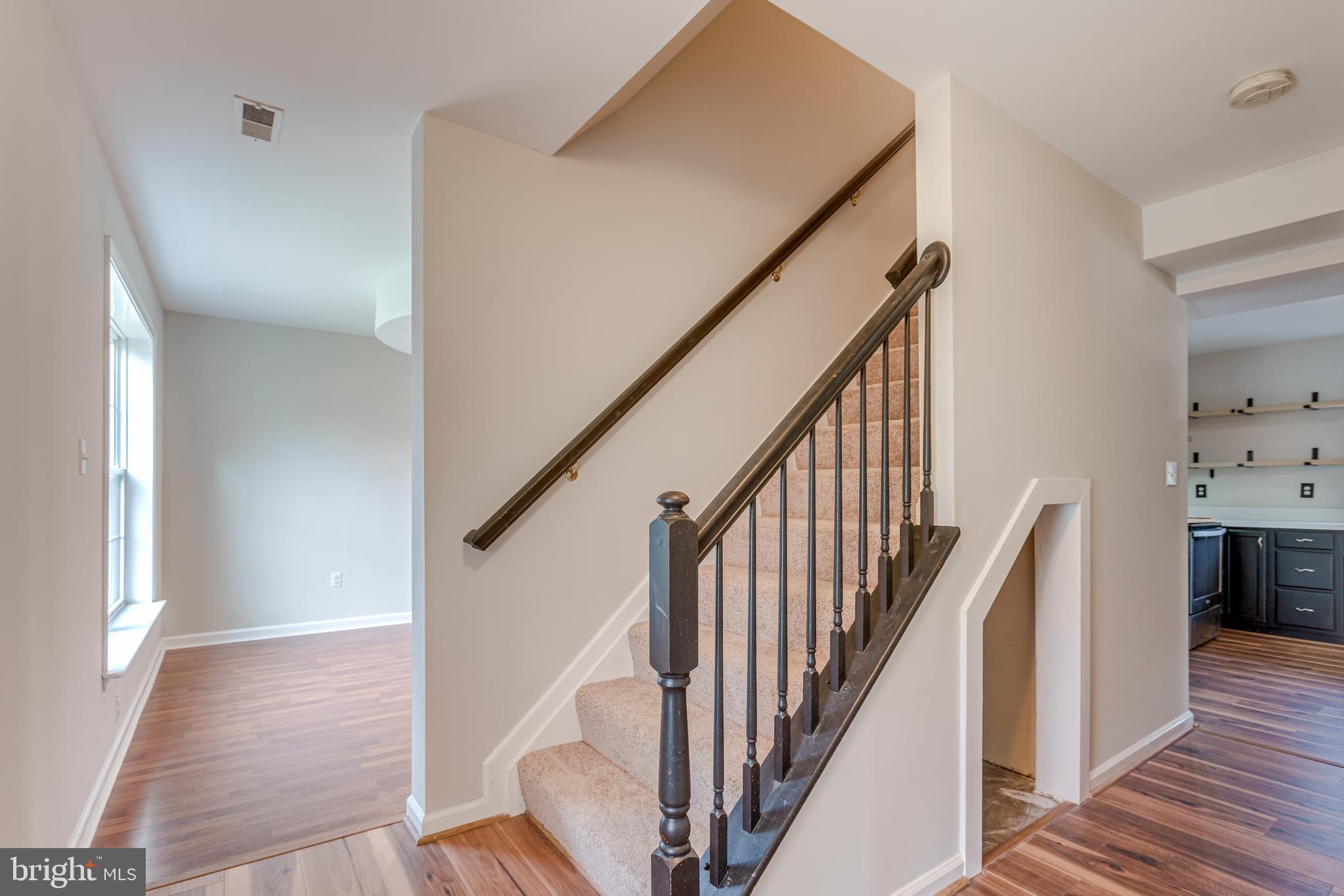 25308 Military Road Cascade, MD 21719 - Photo 7 of 43 a view of a hallway with wooden floor and staircase