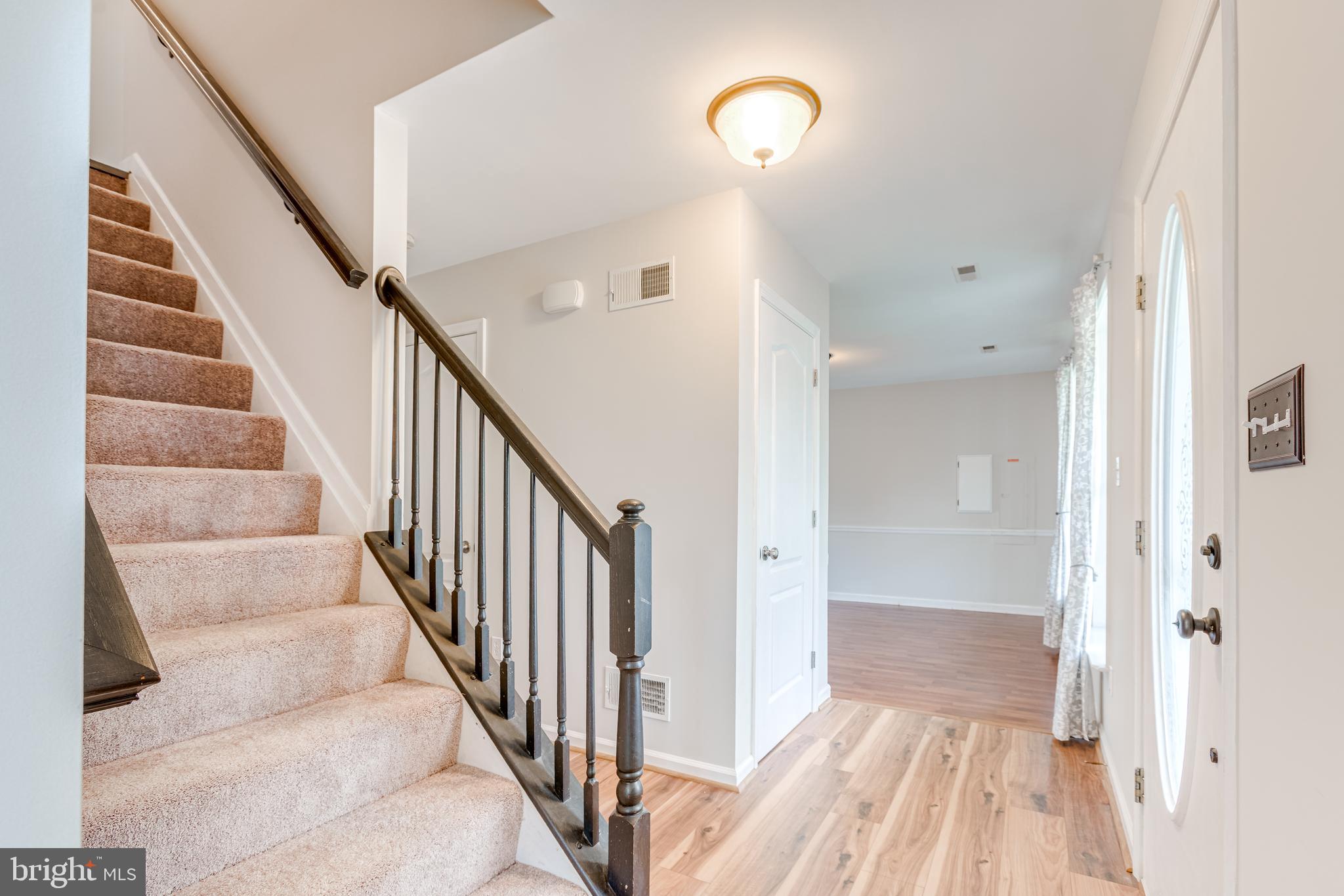 25308 Military Road Cascade, MD 21719 - Photo 8 of 43 a view of a hallway with wooden floor and staircase
