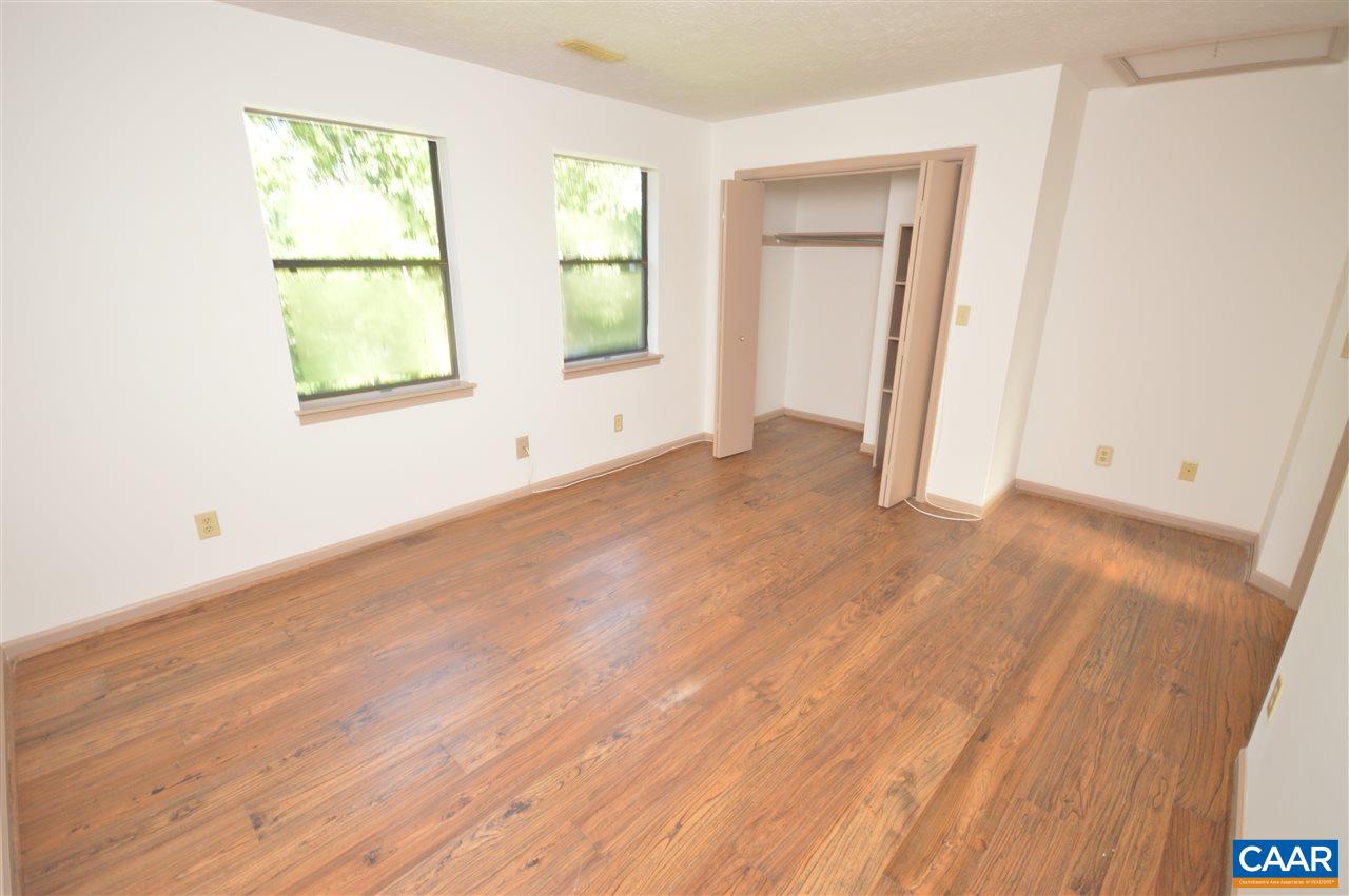 95 Westview Road Ruckersville, VA 22968 - Photo 21 of 42 an empty room with wooden floor and windows