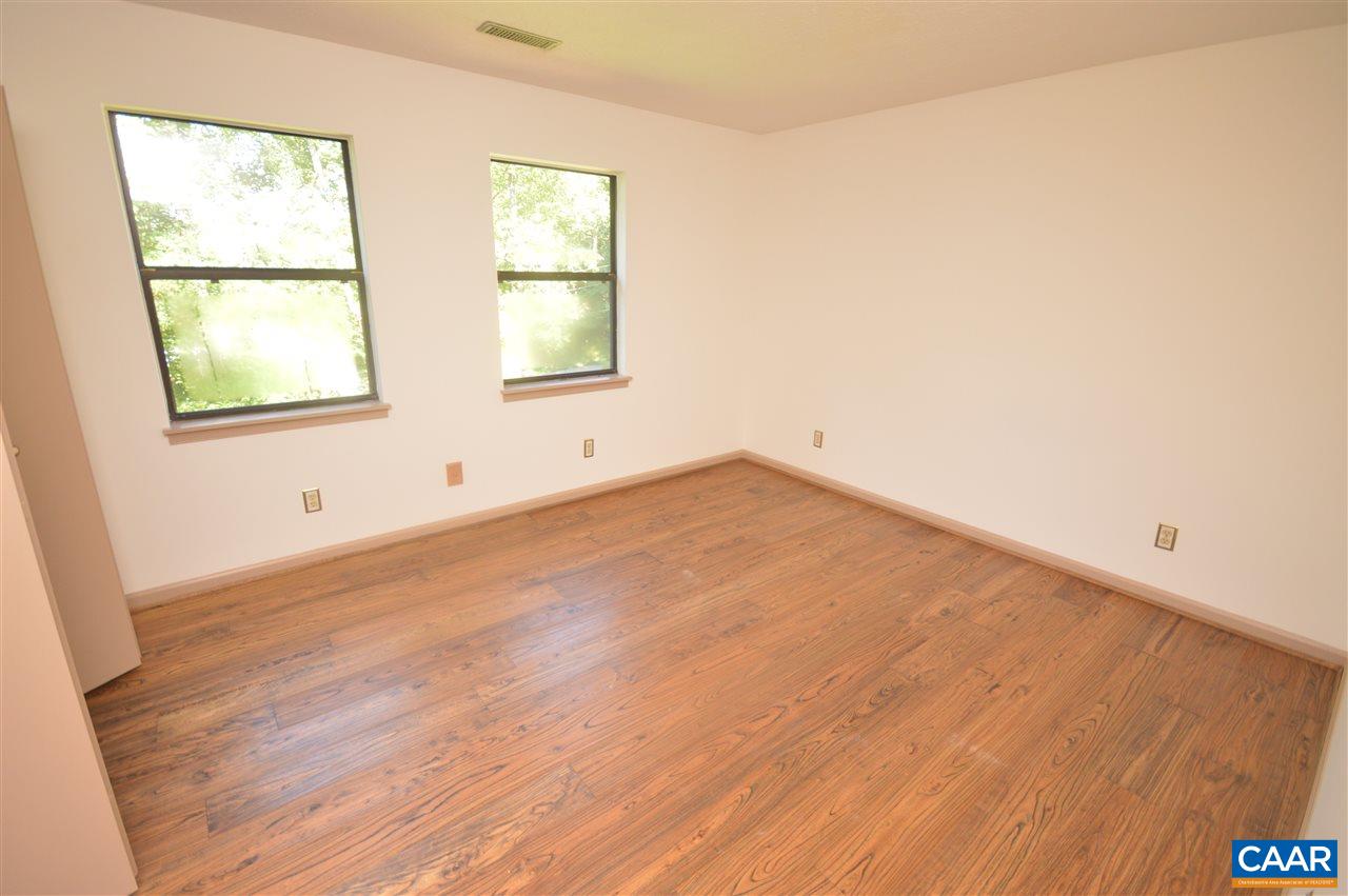 95 Westview Road Ruckersville, VA 22968 - Photo 25 of 42 an empty room with wooden floor and windows