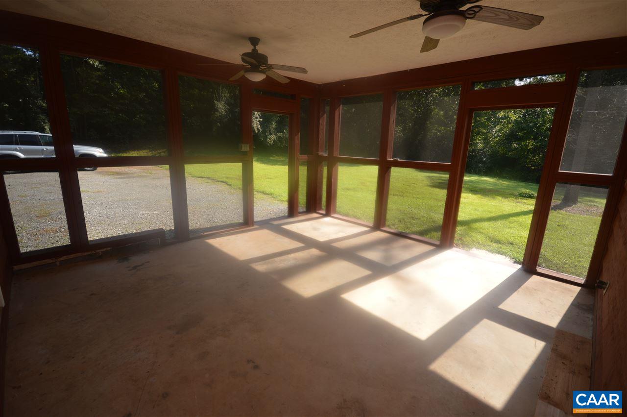 95 Westview Road Ruckersville, VA 22968 - Photo 27 of 42 a bedroom with a bed and a large window