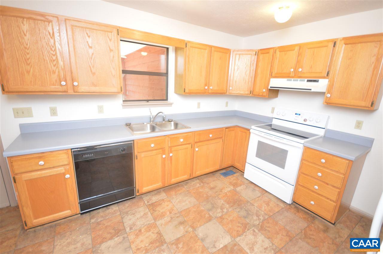 95 Westview Road Ruckersville, VA 22968 - Photo 33 of 42 a kitchen with stainless steel appliances granite countertop a sink stove and microwave