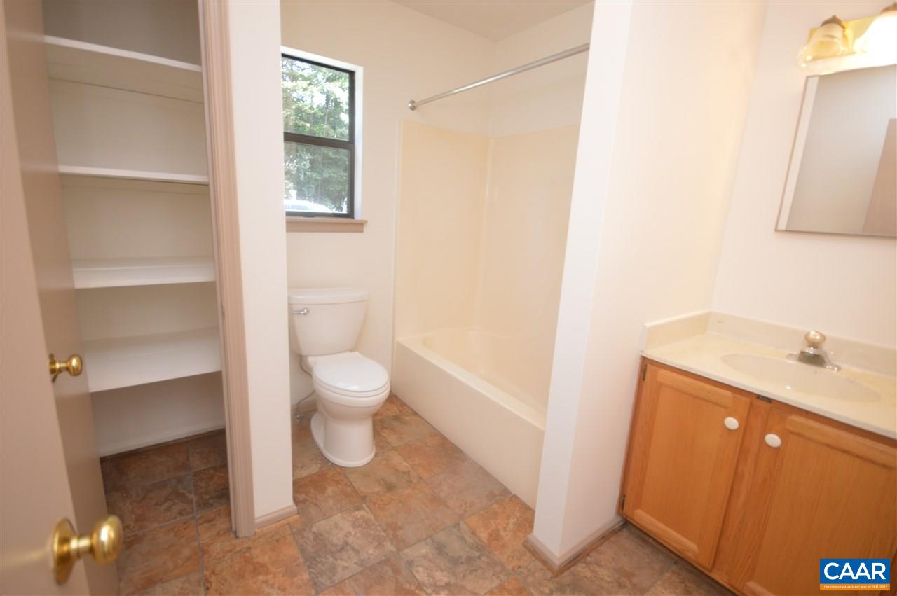 95 Westview Road Ruckersville, VA 22968 - Photo 34 of 42 a bathroom with a toilet sink and mirror