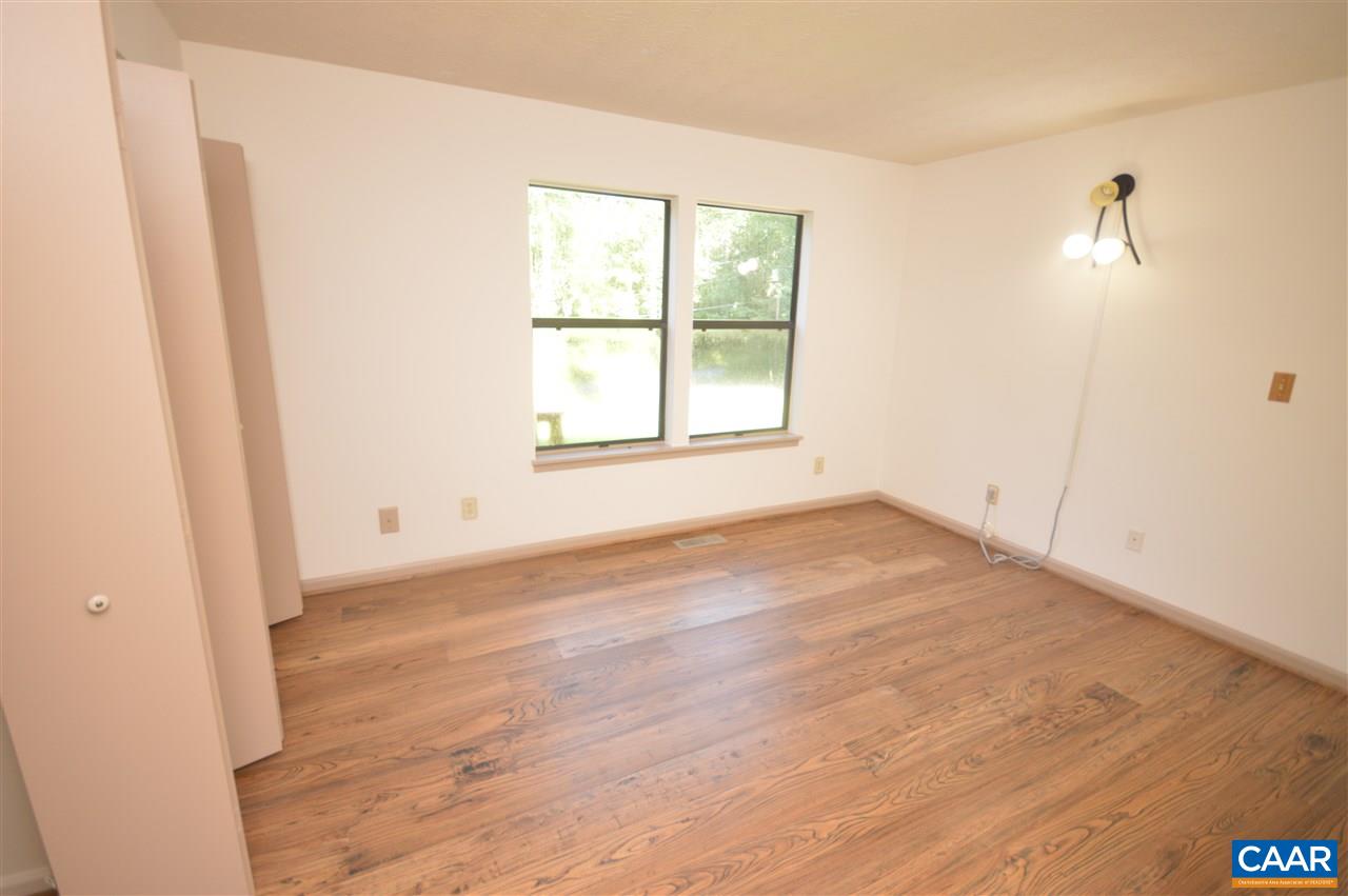 95 Westview Road Ruckersville, VA 22968 - Photo 35 of 42 an empty room with wooden floor and windows