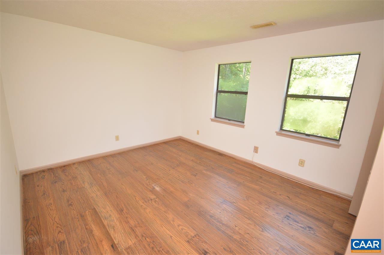 95 Westview Road Ruckersville, VA 22968 - Photo 37 of 42 an empty room with wooden floor and windows
