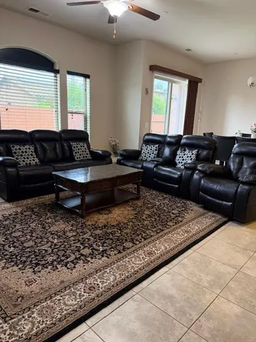 a living room with a couch and a large window