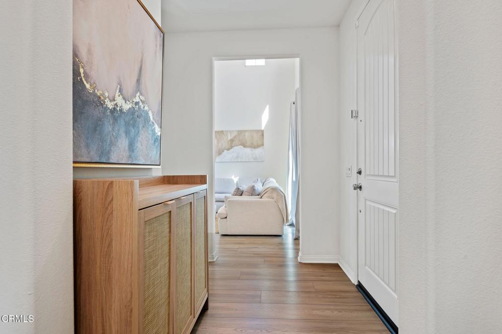 1991 Pomegranate Street Santa Paula, CA 93060 - Photo 13 of 46 a room with a walk in closet and wooden floor