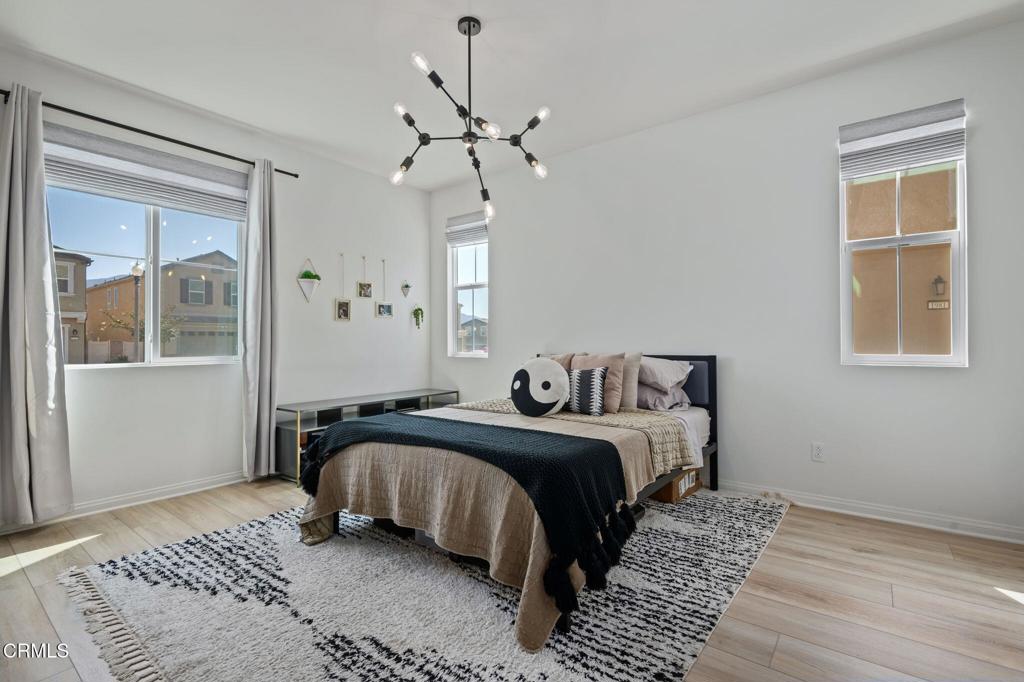 1991 Pomegranate Street Santa Paula, CA 93060 - Photo 15 of 46 a bedroom with a large bed and a window