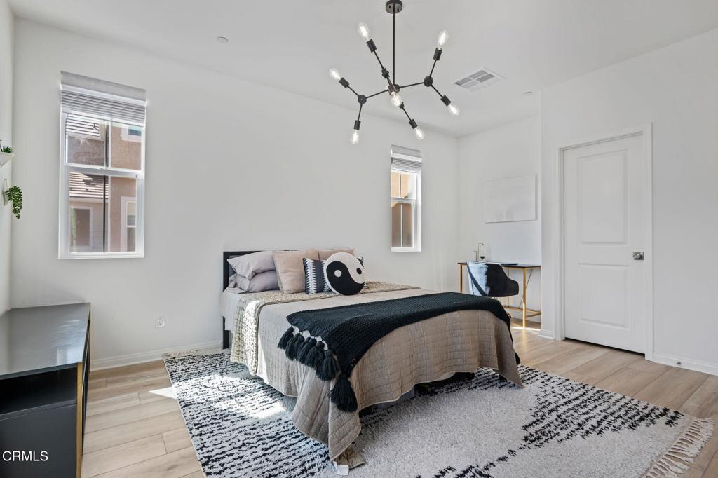 1991 Pomegranate Street Santa Paula, CA 93060 - Photo 16 of 46 a bedroom with a large bed and a window