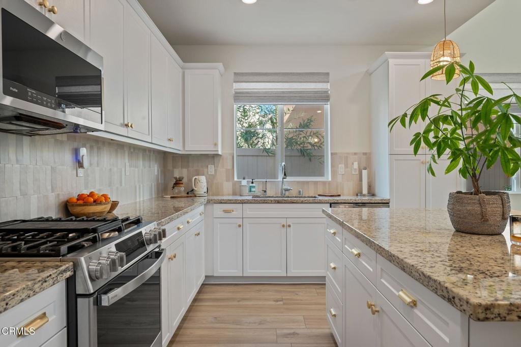 1991 Pomegranate Street Santa Paula, CA 93060 - Photo 24 of 46 a kitchen with sink a window and potted plant