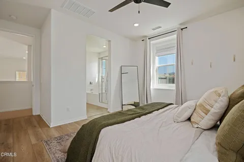 a bedroom with a bed and a walk in closet