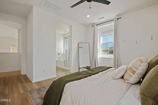 a bedroom with a bed and a walk in closet