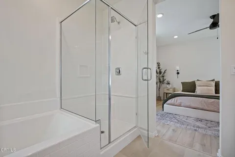a bathroom with a bathtub and a shower