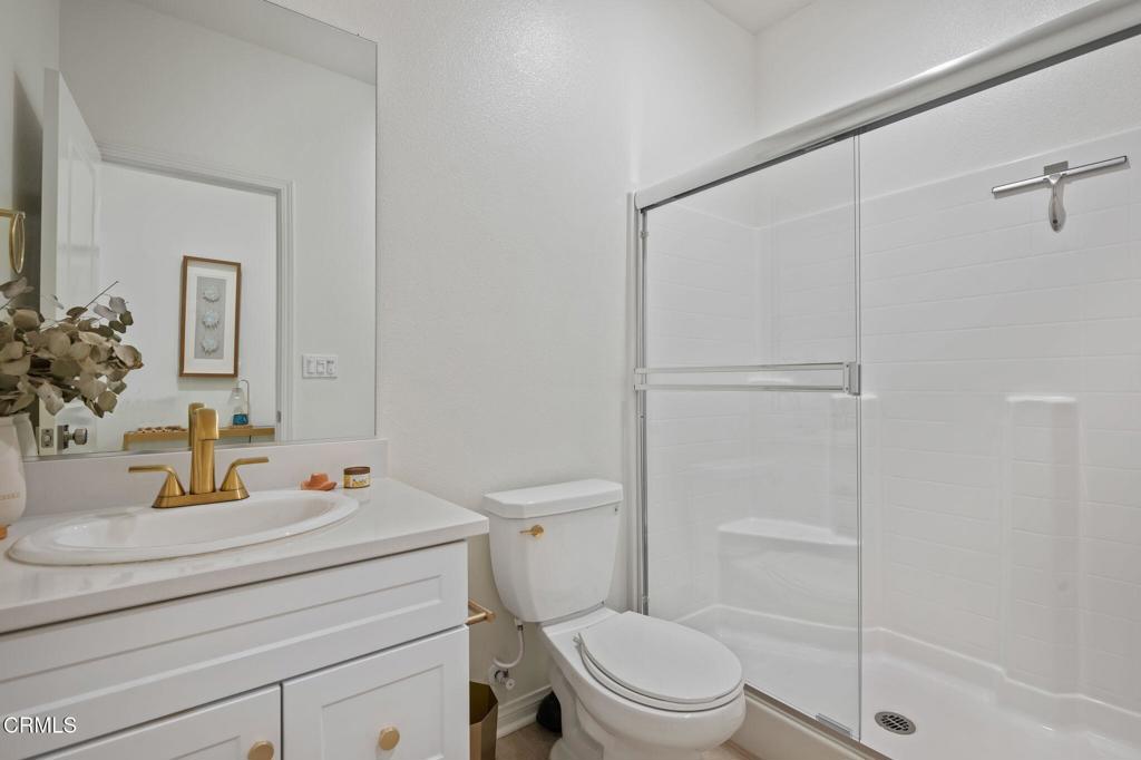 1991 Pomegranate Street Santa Paula, CA 93060 - Photo 31 of 46 a bathroom with a sink a toilet and shower