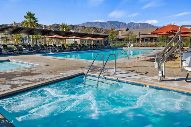 a view of a swimming pool with a lounge chairs