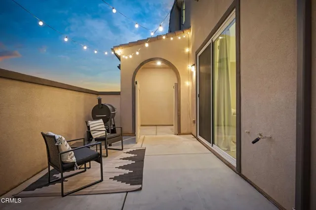 a view of a hallway with seating area