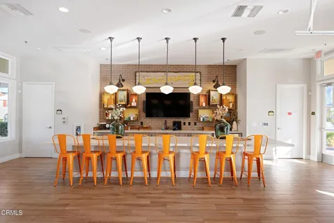 a view of dining room and hall with wooden floor