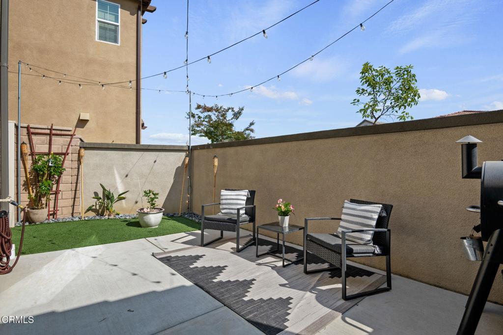 1991 Pomegranate Street Santa Paula, CA 93060 - Photo 10 of 46 a backyard of a house with table and chairs
