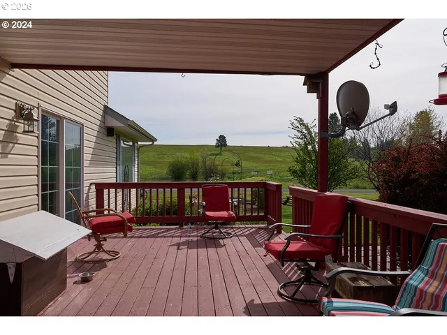 a view of balcony with wooden floor