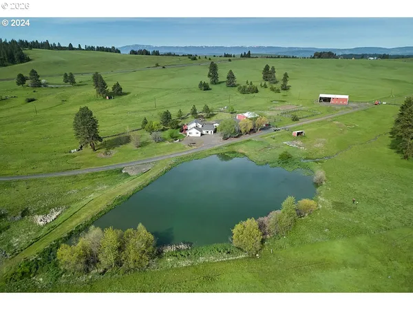 a view of a lake with a yard