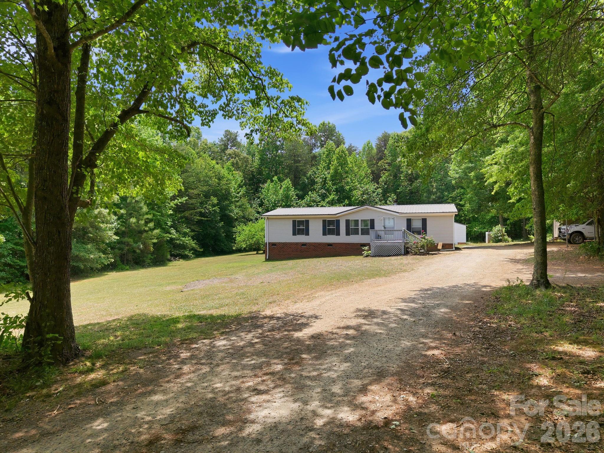 675 Overcash Road Salisbury, NC 28147 - Photo 7 of 48 a house with trees in the background