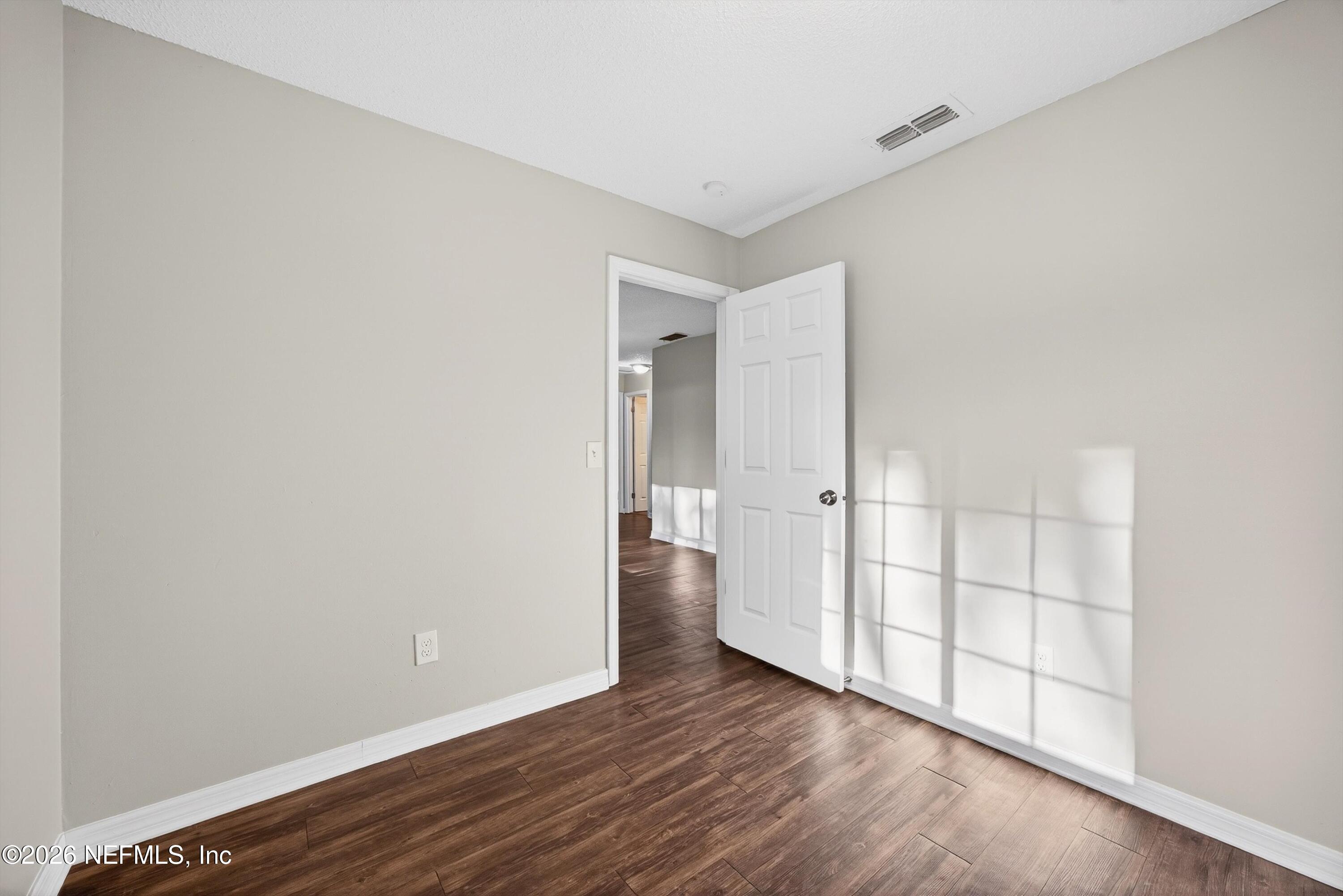 591 Julia Street St. Augustine, FL 32084 - Photo 11 of 25 a view of wooden floor and windows in a room