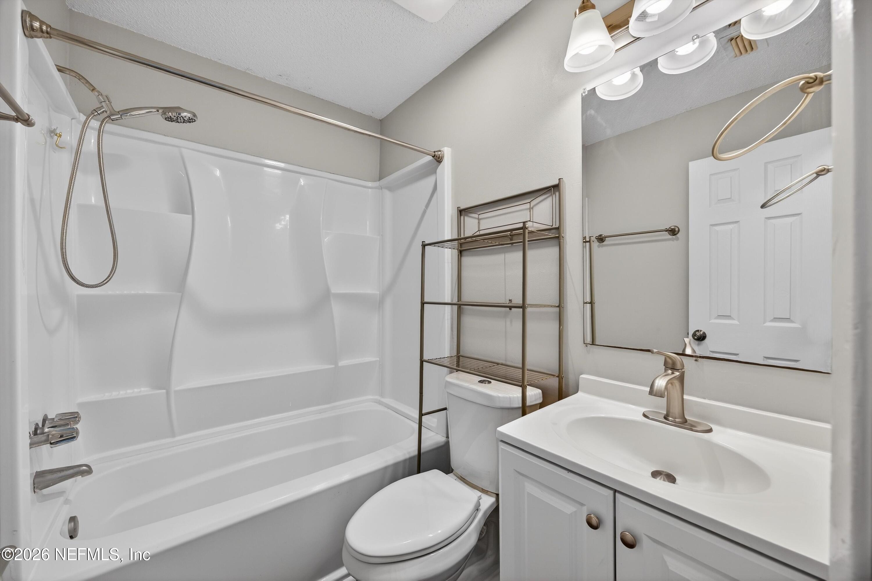 591 Julia Street St. Augustine, FL 32084 - Photo 12 of 25 a bathroom with a sink toilet and shower