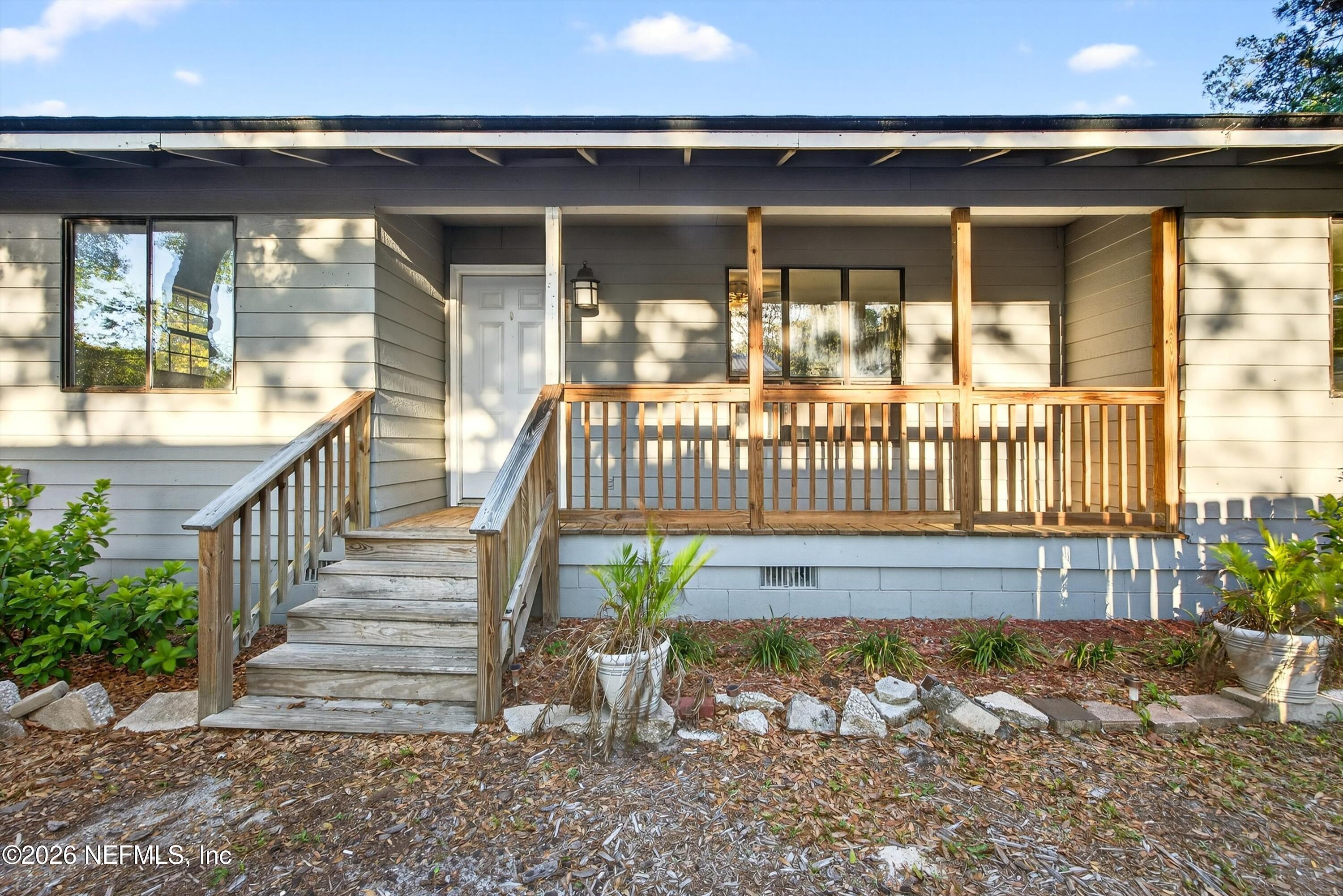 591 Julia Street St. Augustine, FL 32084 - Photo 2 of 25 a view of stairs and a yard