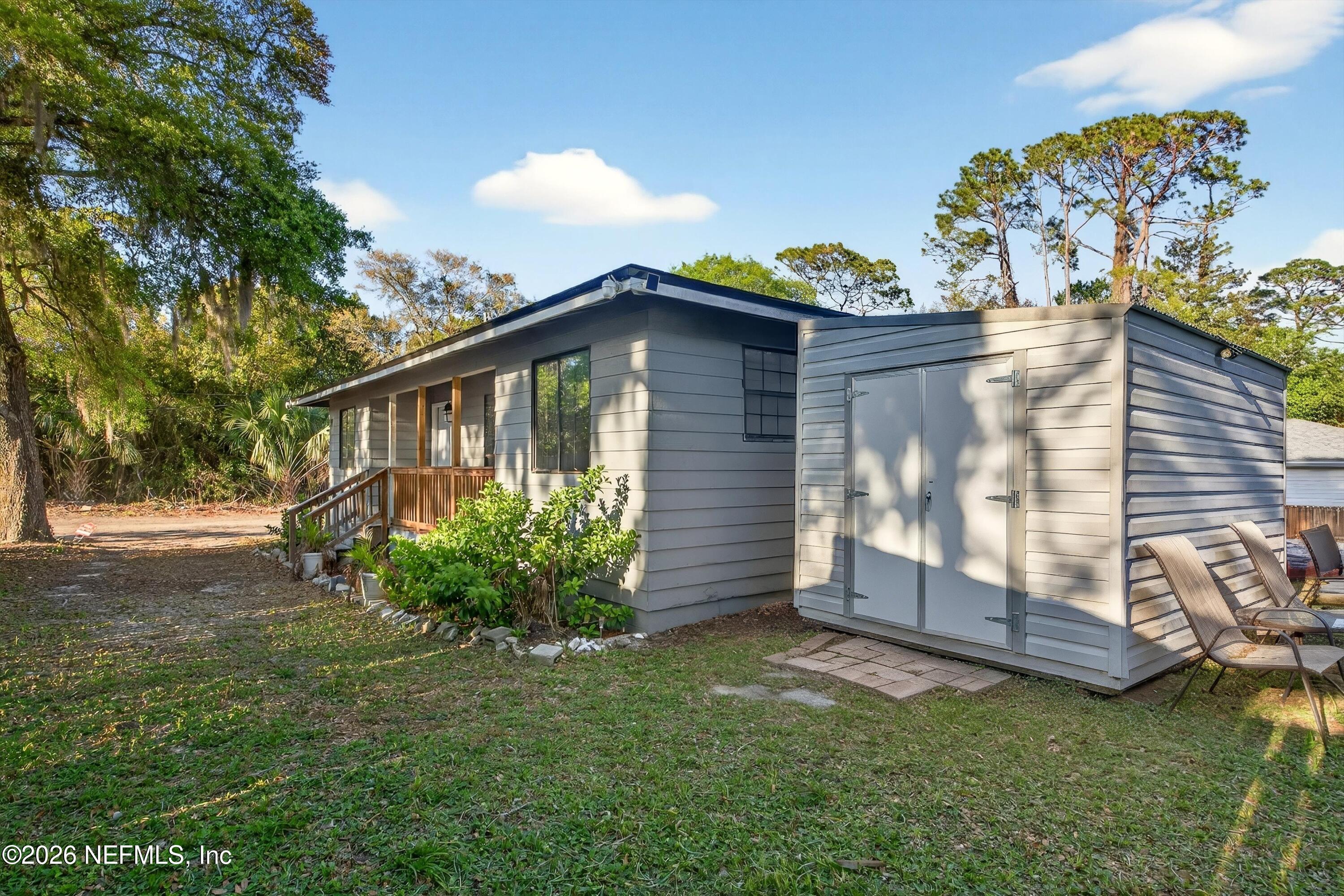 591 Julia Street St. Augustine, FL 32084 - Photo 21 of 25 a front view of a house with garden