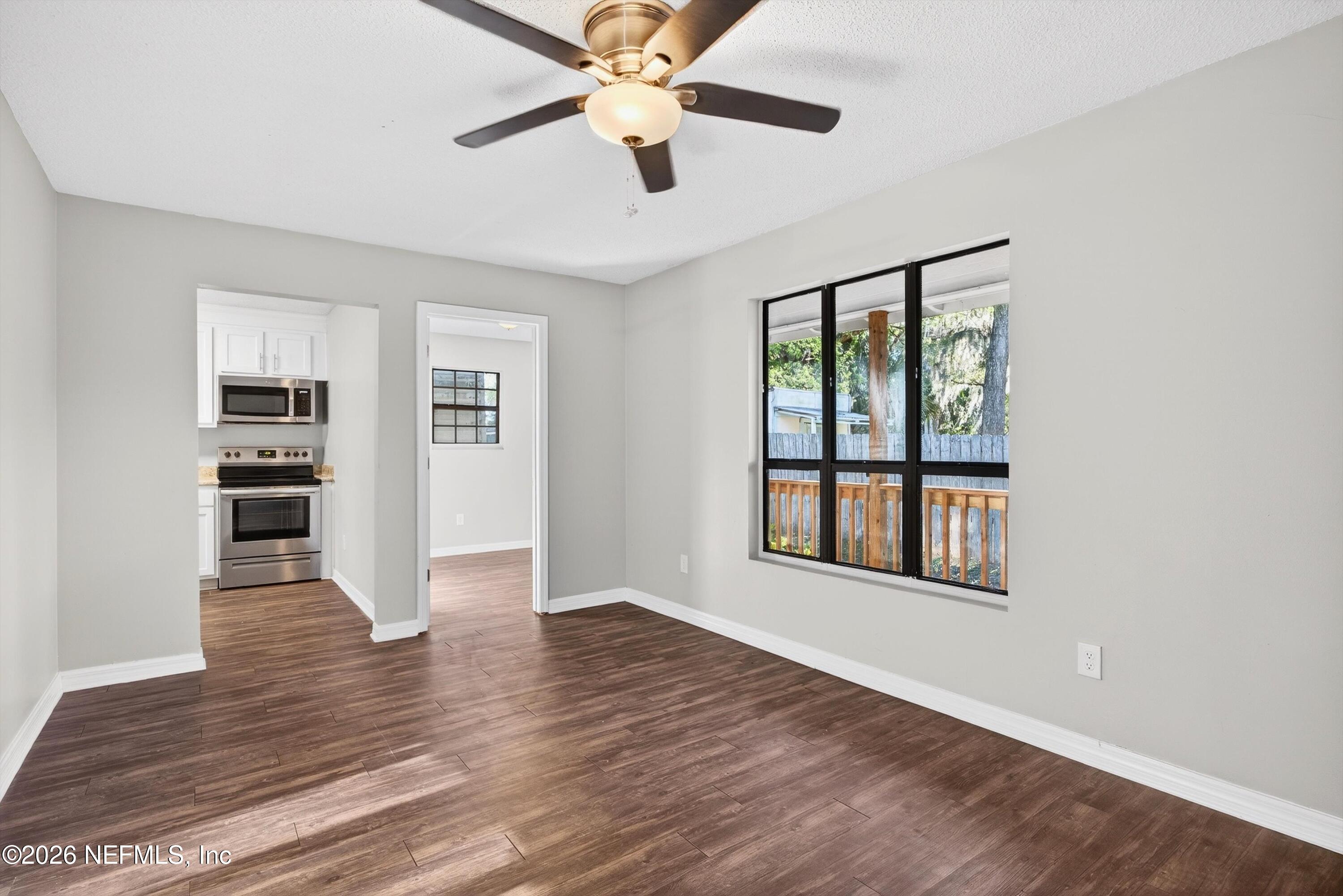 591 Julia Street St. Augustine, FL 32084 - Photo 5 of 25 a view of empty room with wooden floor and fan