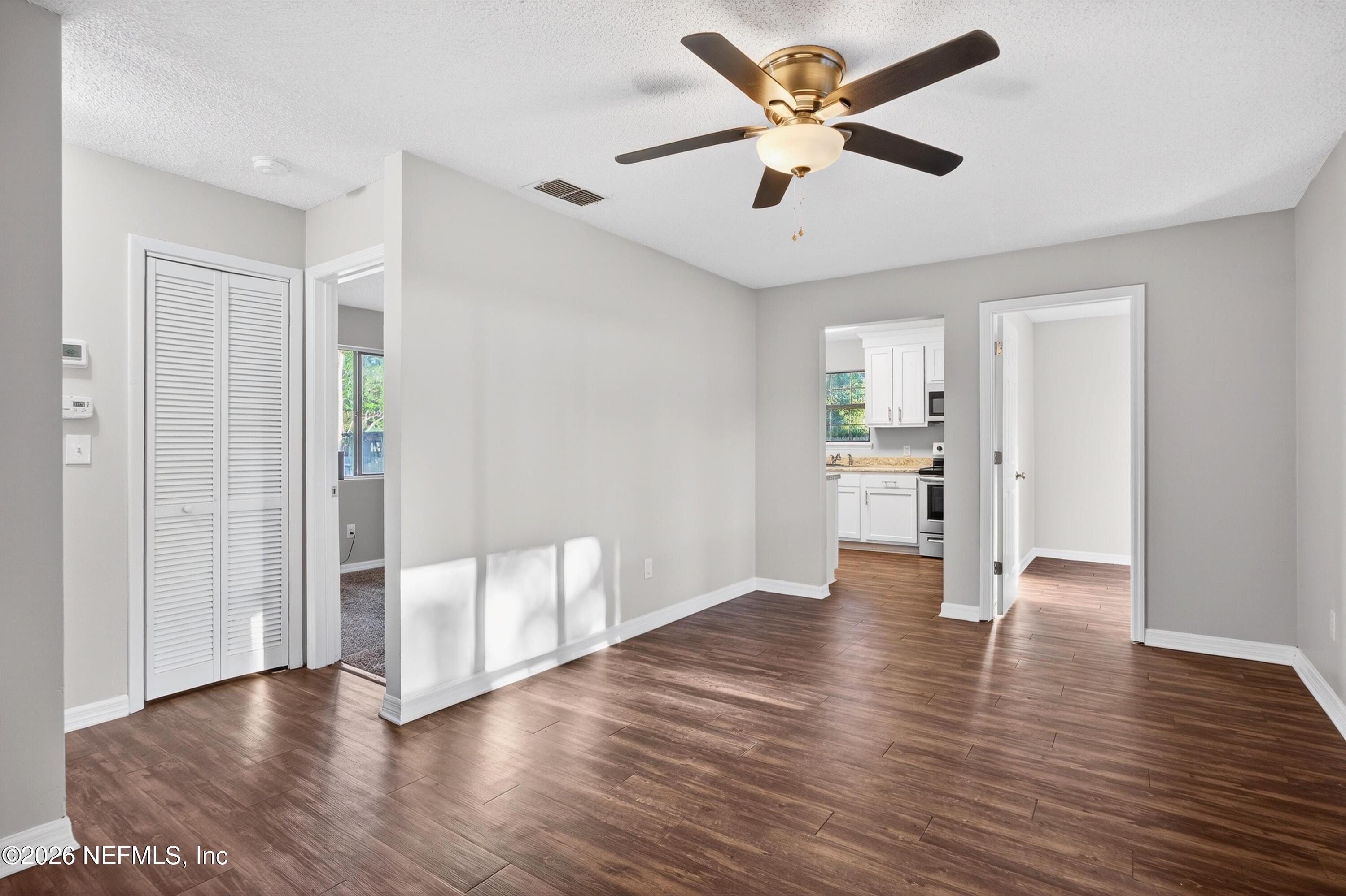 591 Julia Street St. Augustine, FL 32084 - Photo 6 of 25 a view of an empty room with window and wooden floor