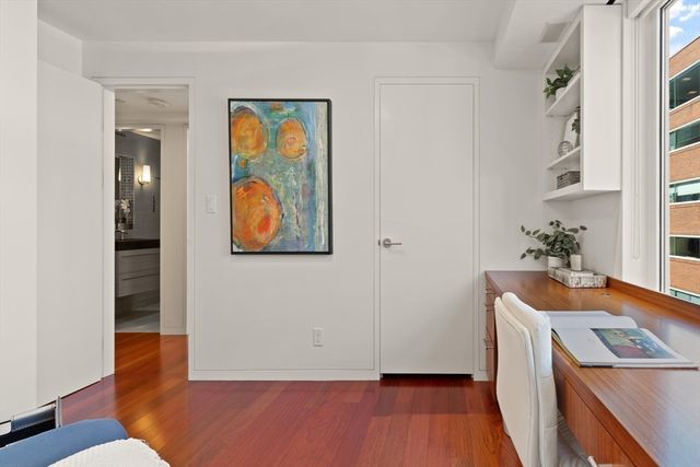 a bed room with a bed and a night stand