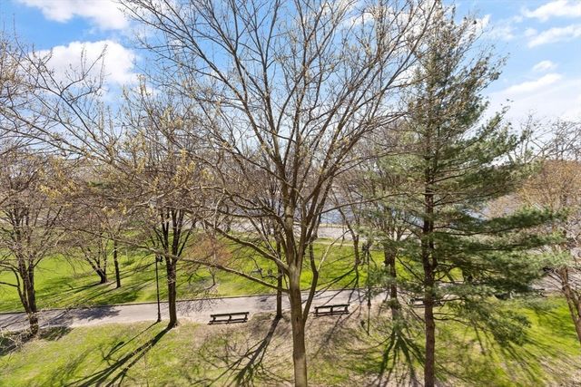 a patio with a table and chairs under an umbrella
