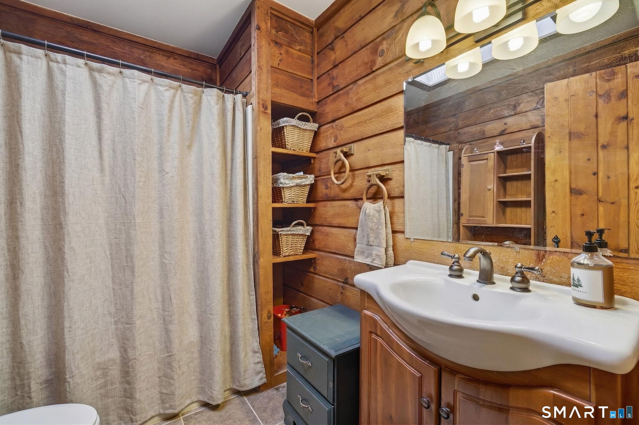 737 Shepard Avenue Hamden, CT 06514 - Photo 20 of 33 a bathroom with a sink and a mirror