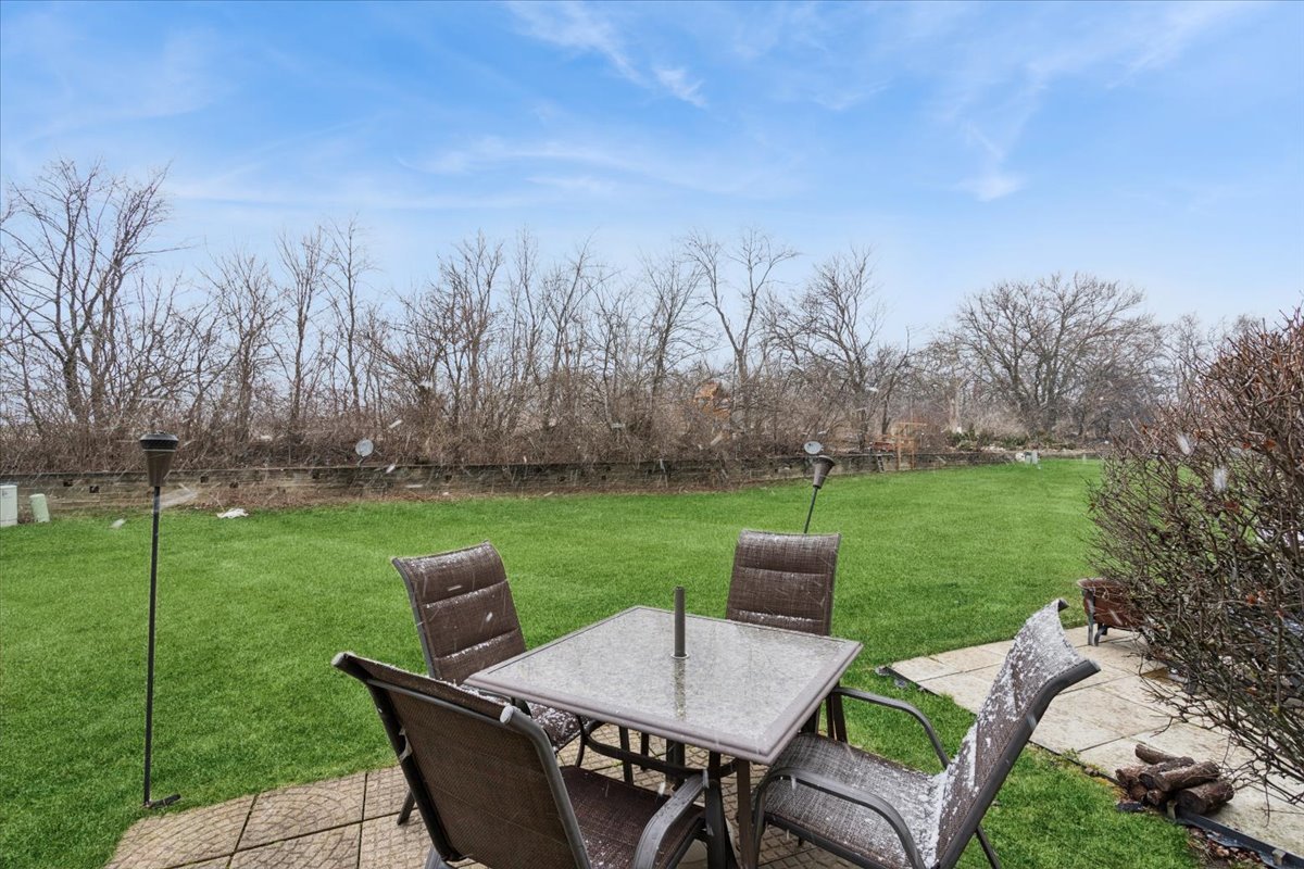 14902 West Victoria Crossing Lockport, IL 60441 - Photo 14 of 23 a view of a table and chairs in the garden
