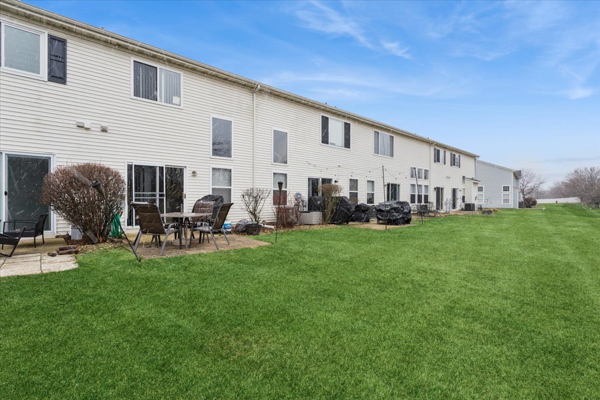 14902 West Victoria Crossing Lockport, IL 60441 - Photo 16 of 23 a view of a house with backyard and porch
